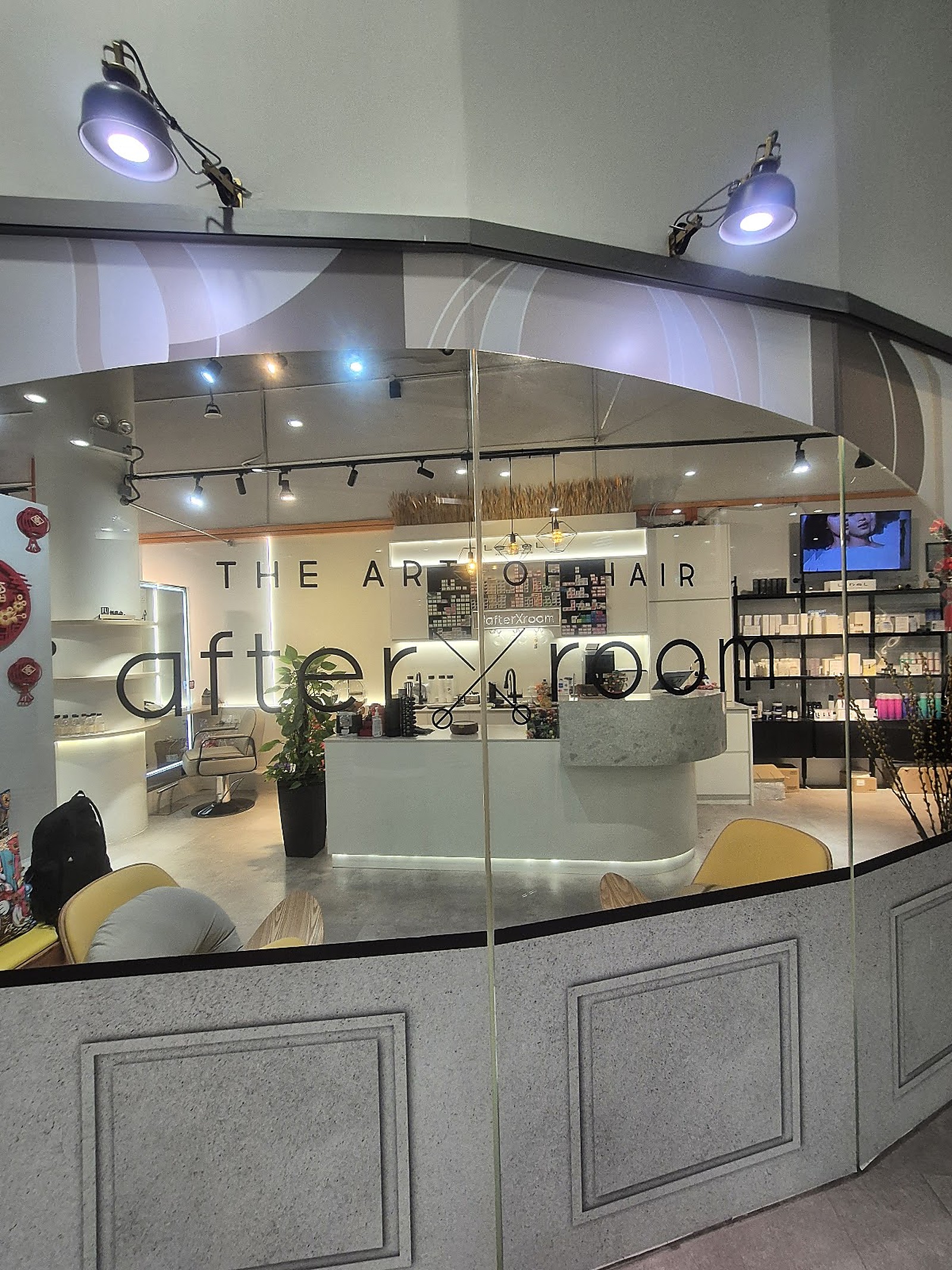 modern salon interior storefront with curated product wall