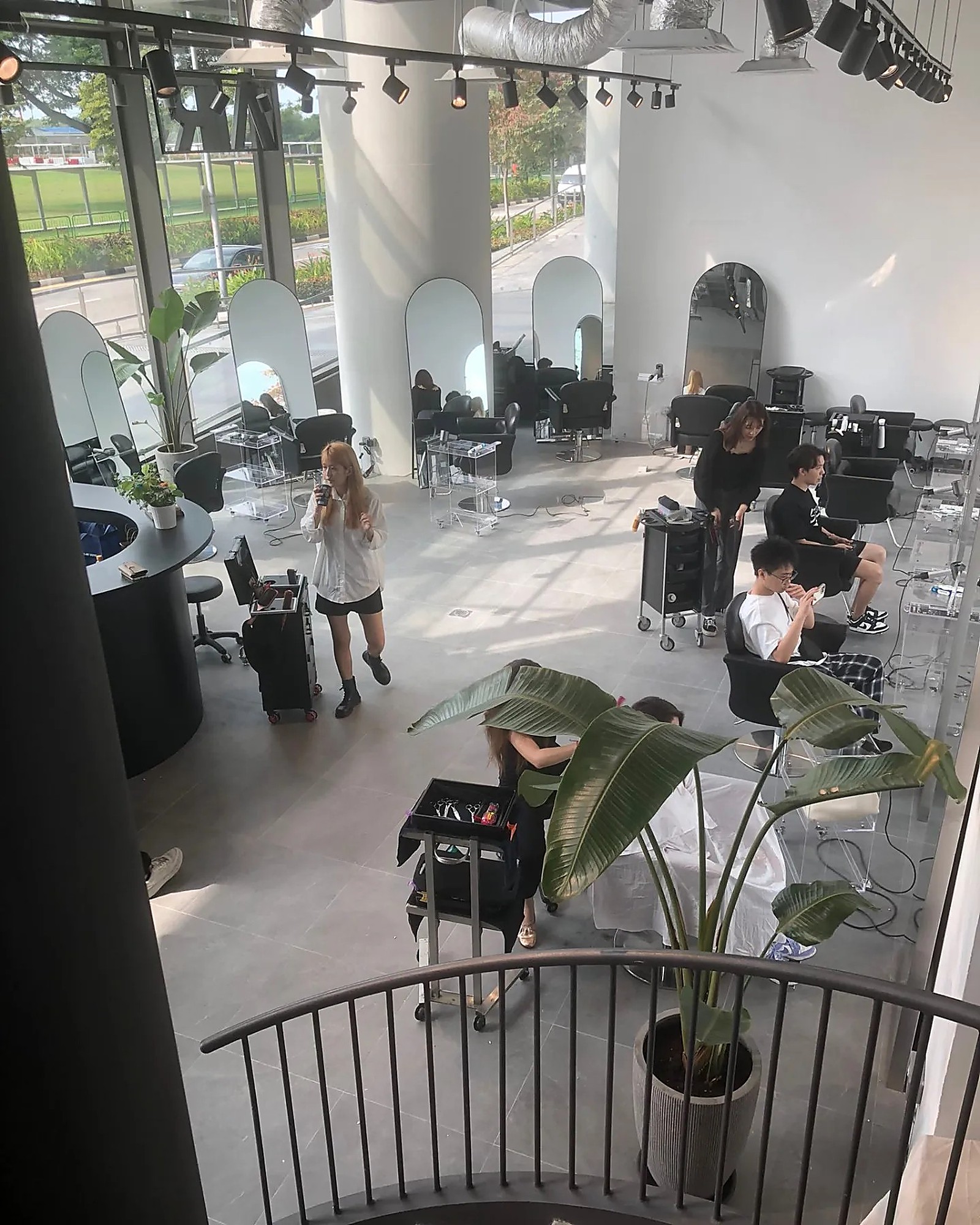Modern AIR Salon Singapore interior with arch mirrors and a calm, light-flooded space