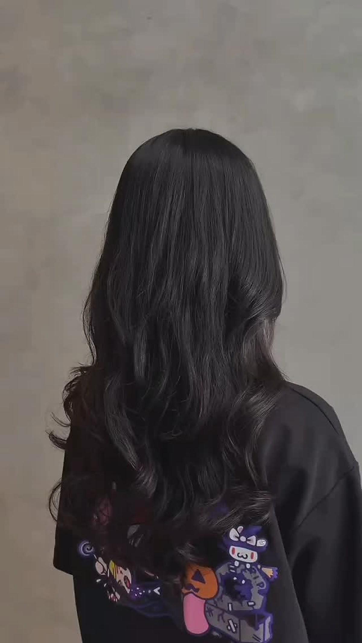Long black hair styled and polished
