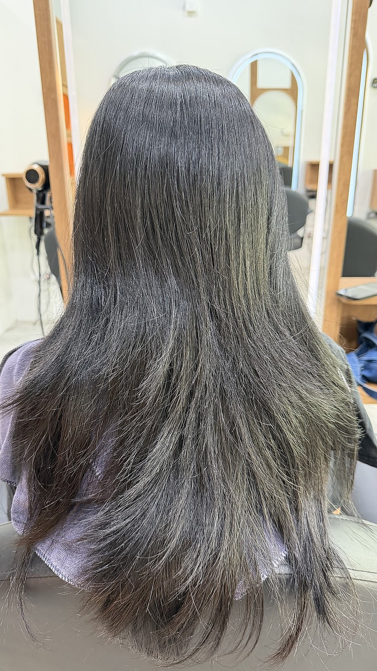 Long dark hair styling result