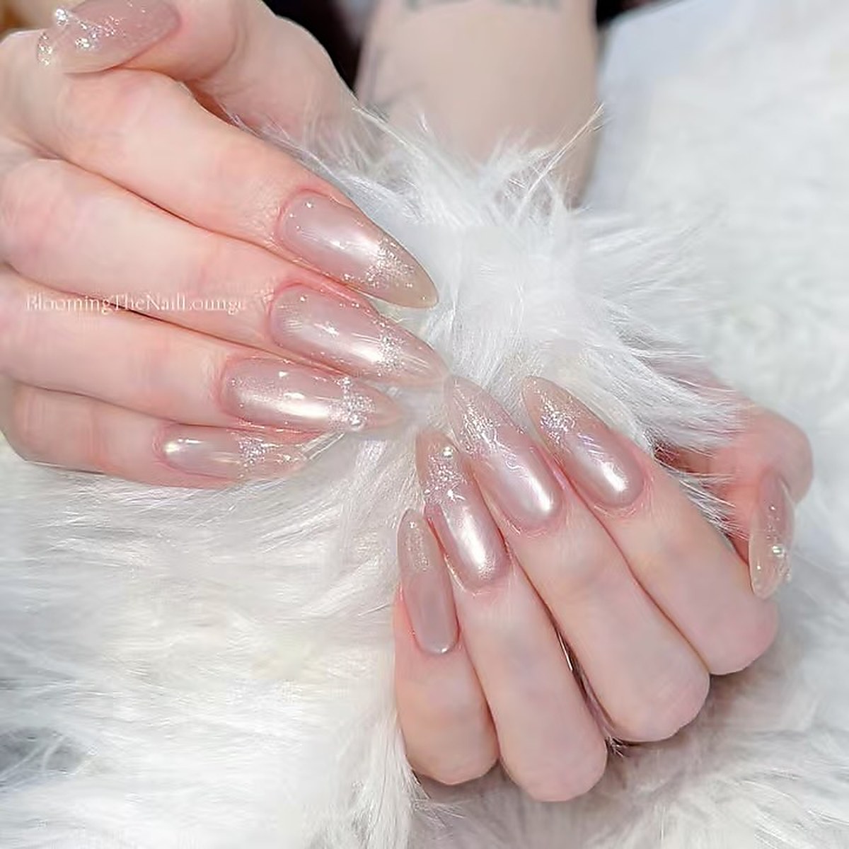 nail_art_glitter_manicure with subtle shimmer
