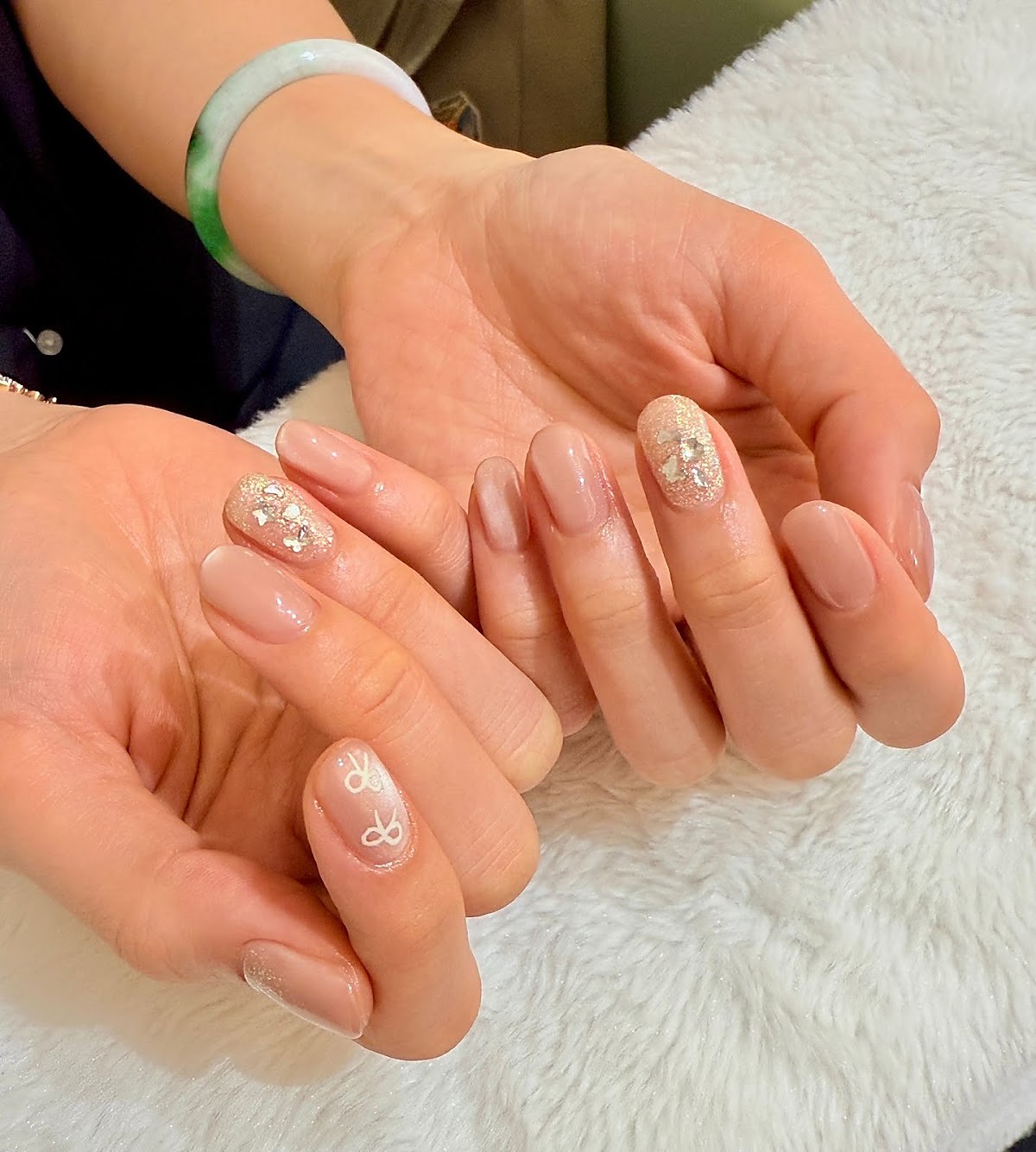 Manicure with glitter finish nail art at ELENURA
