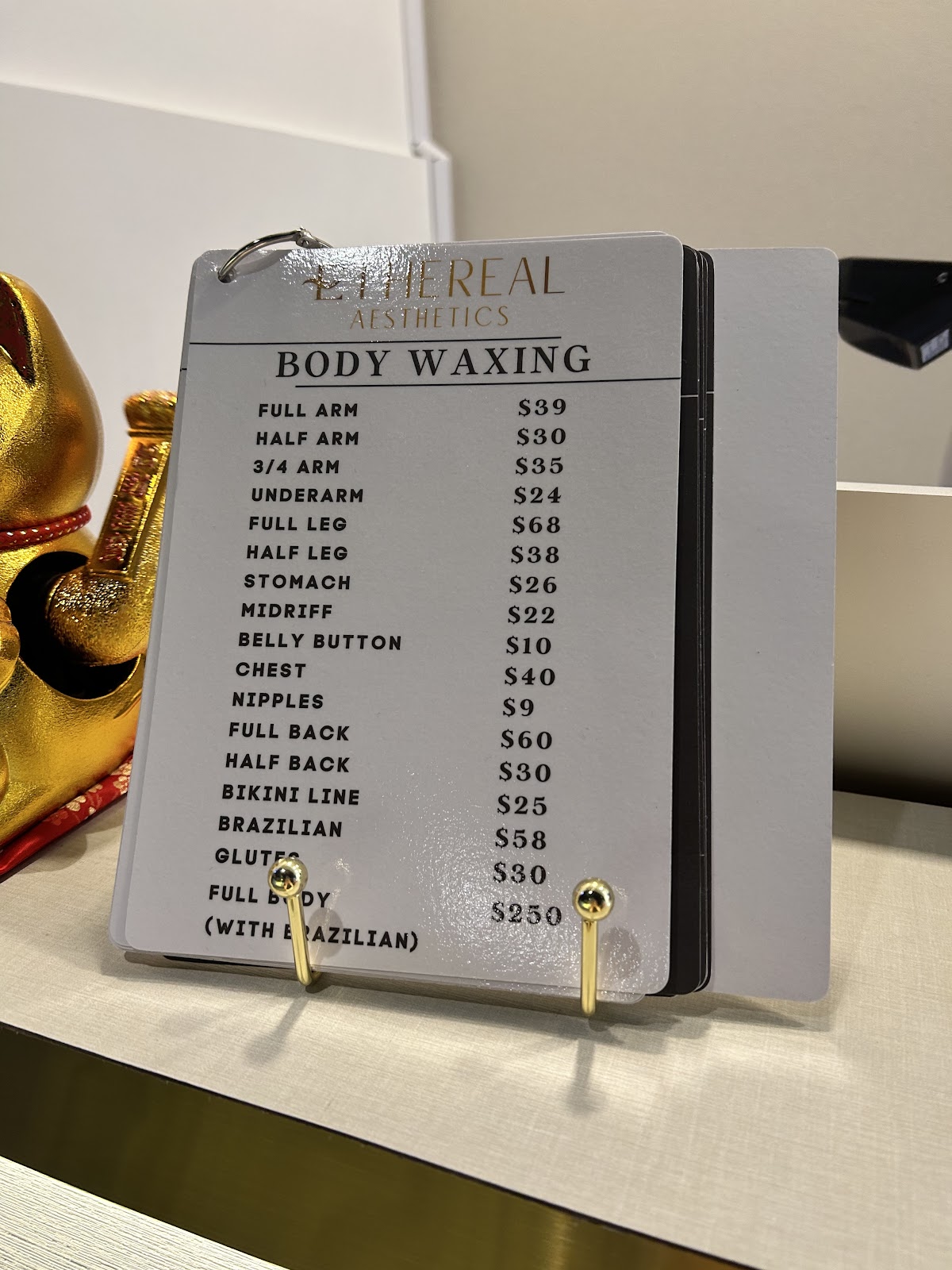 Body waxing service menu displayed at the studio