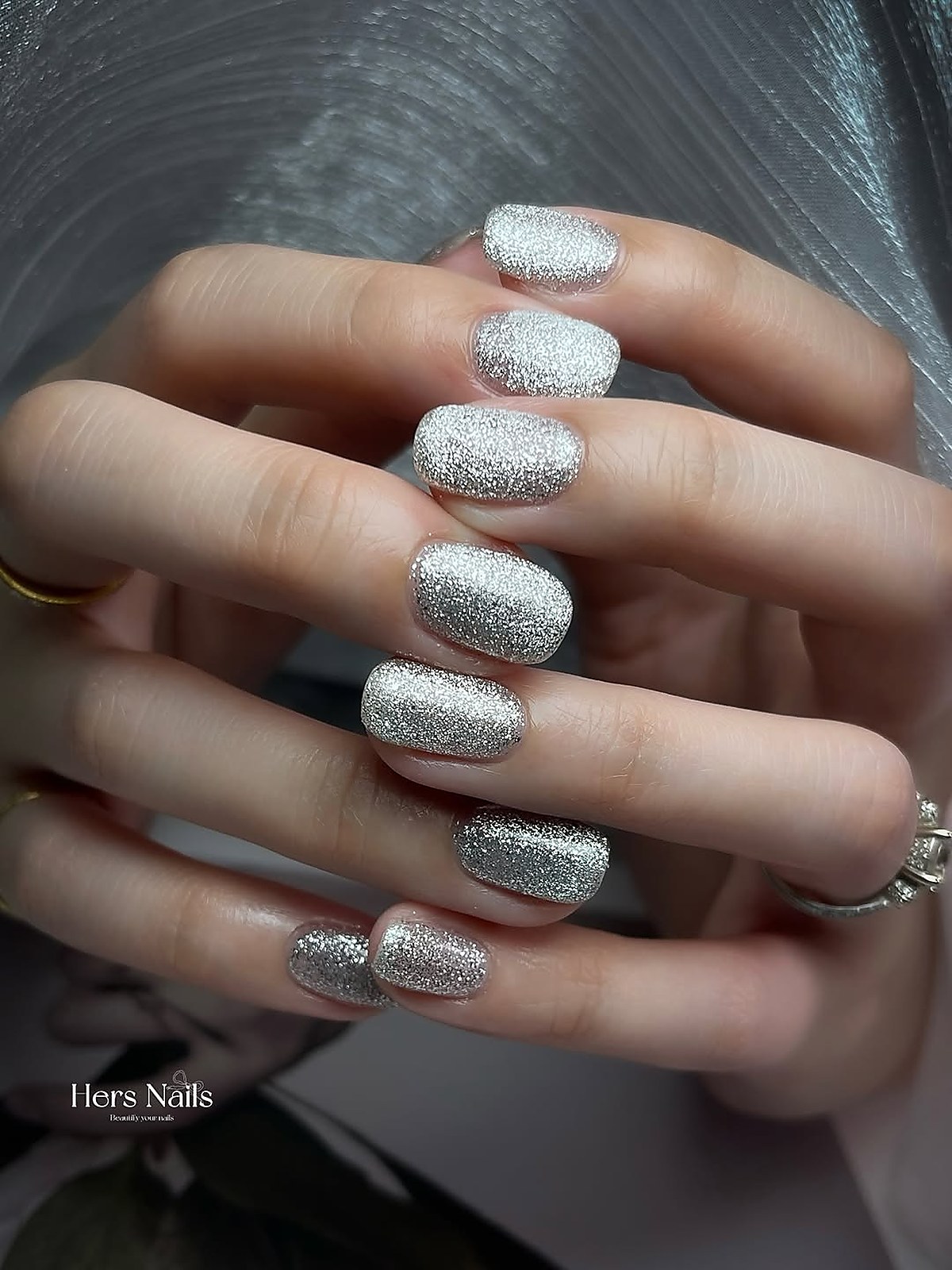 Silver glitter nail art at Hers Nails
