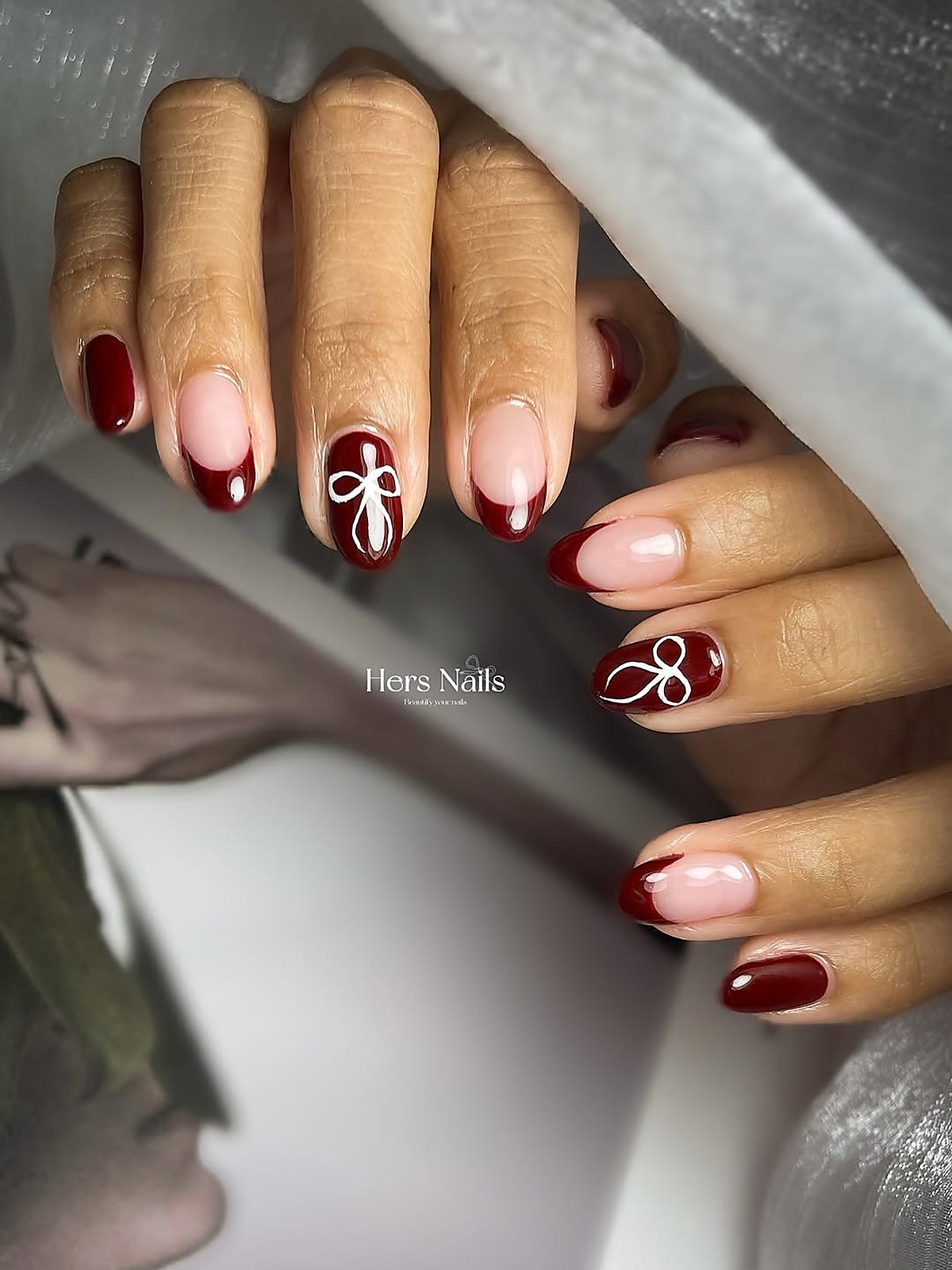 Elegant red nail art design at Hers Nails