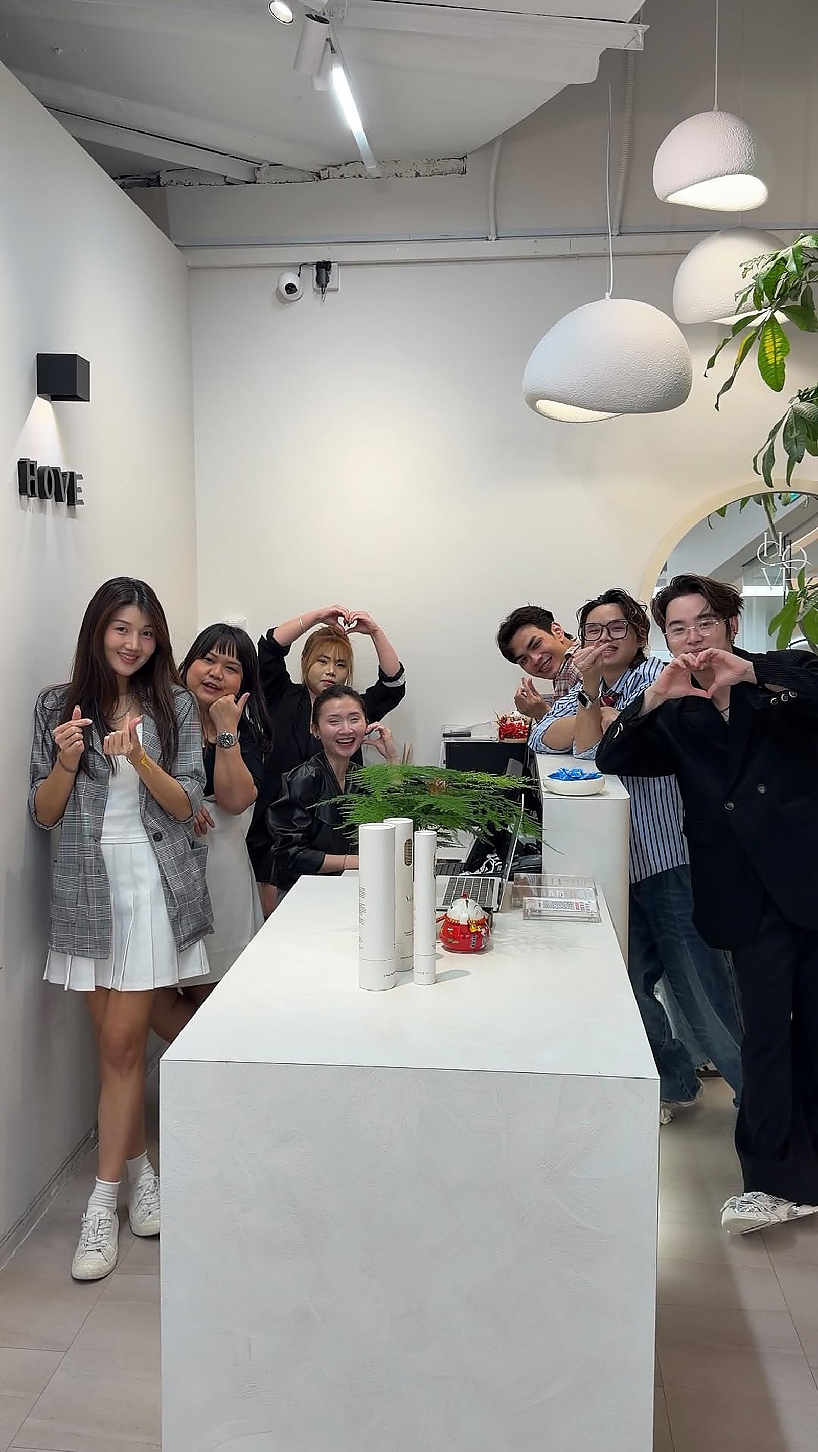 Team group photo casual inside the salon