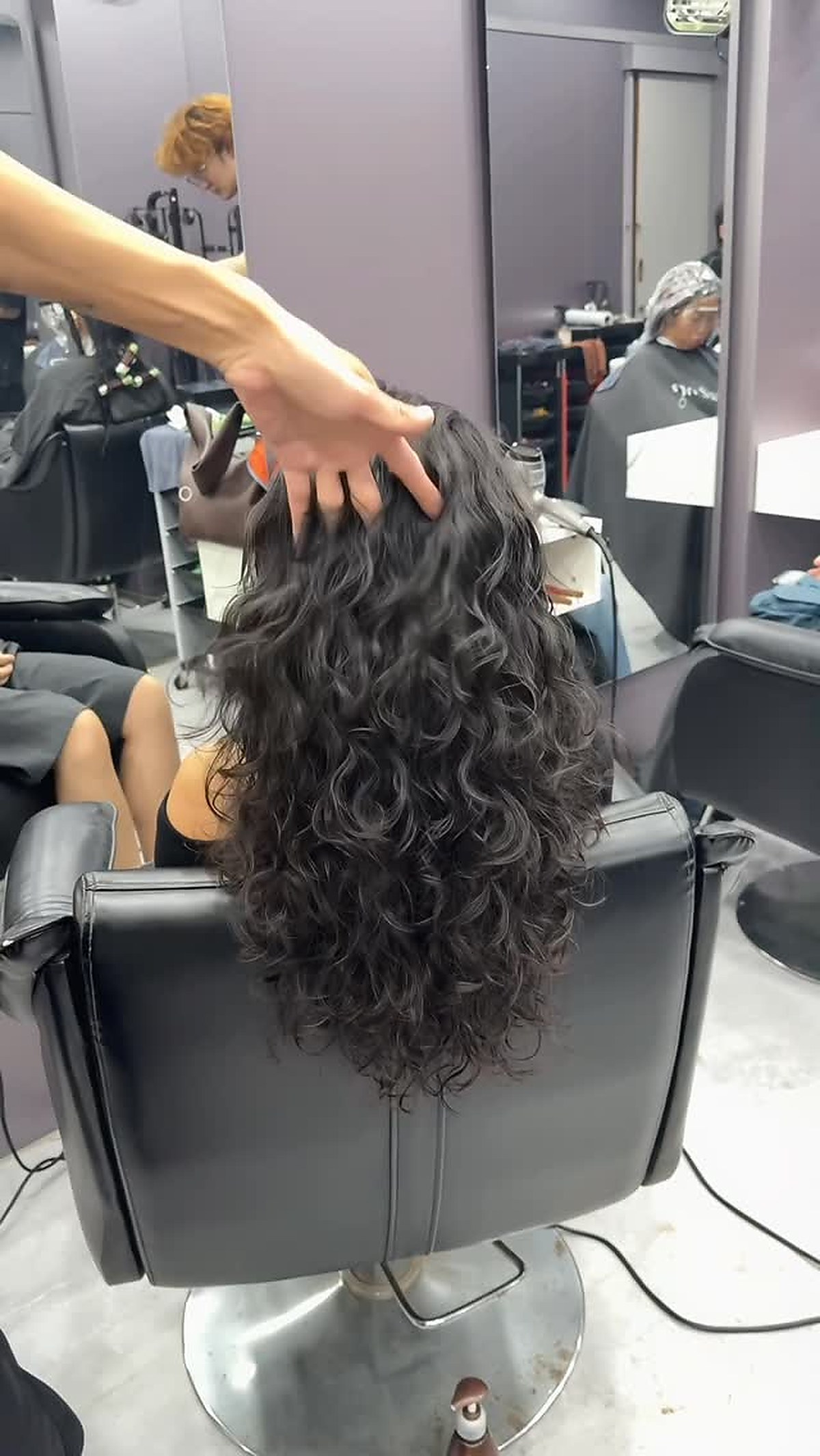 Long wavy hair styling result by I Do Hair Salon