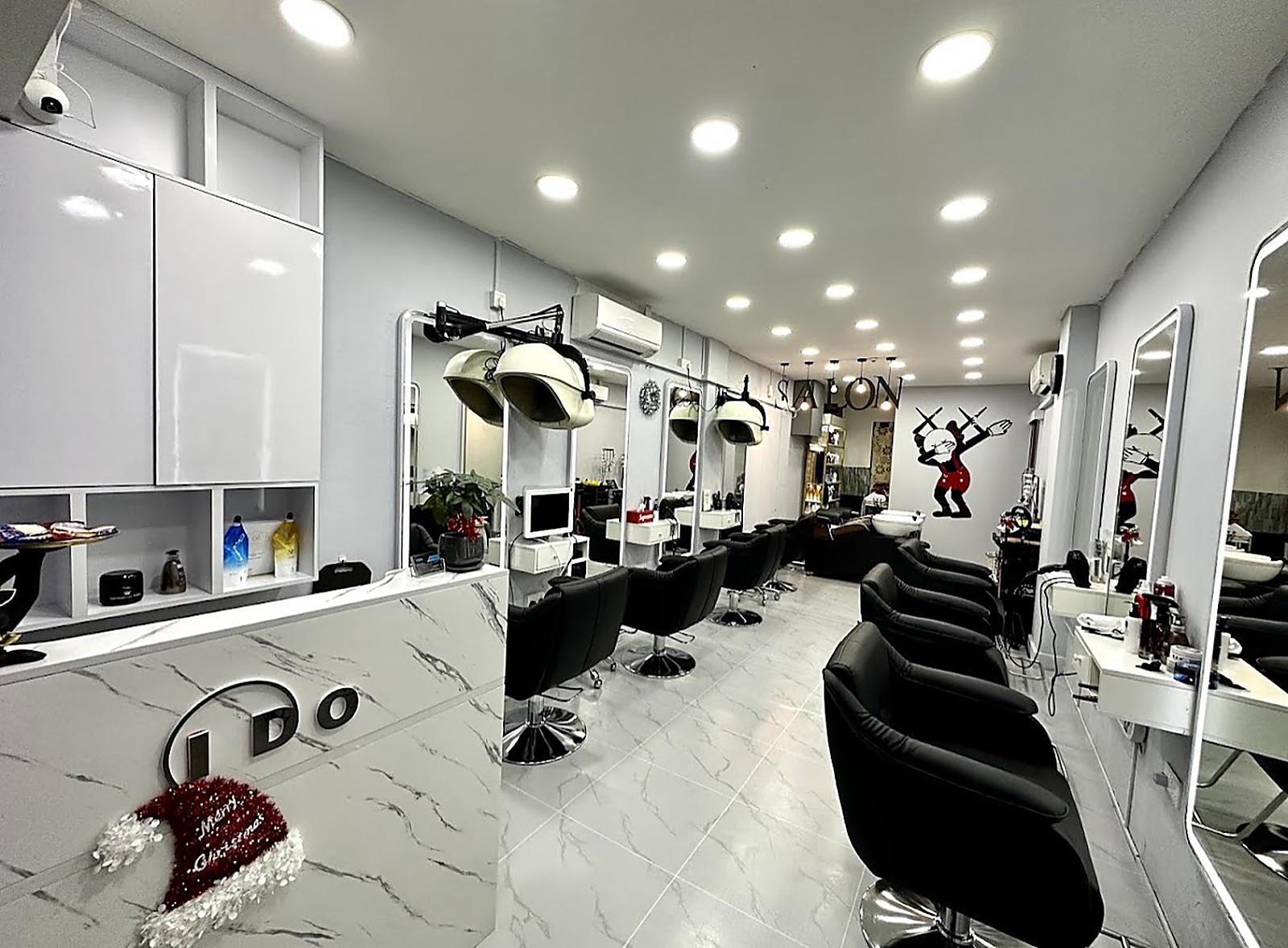 I Do Hair Salon interior with crisp white surfaces and sleek black chairs in Toa Payoh