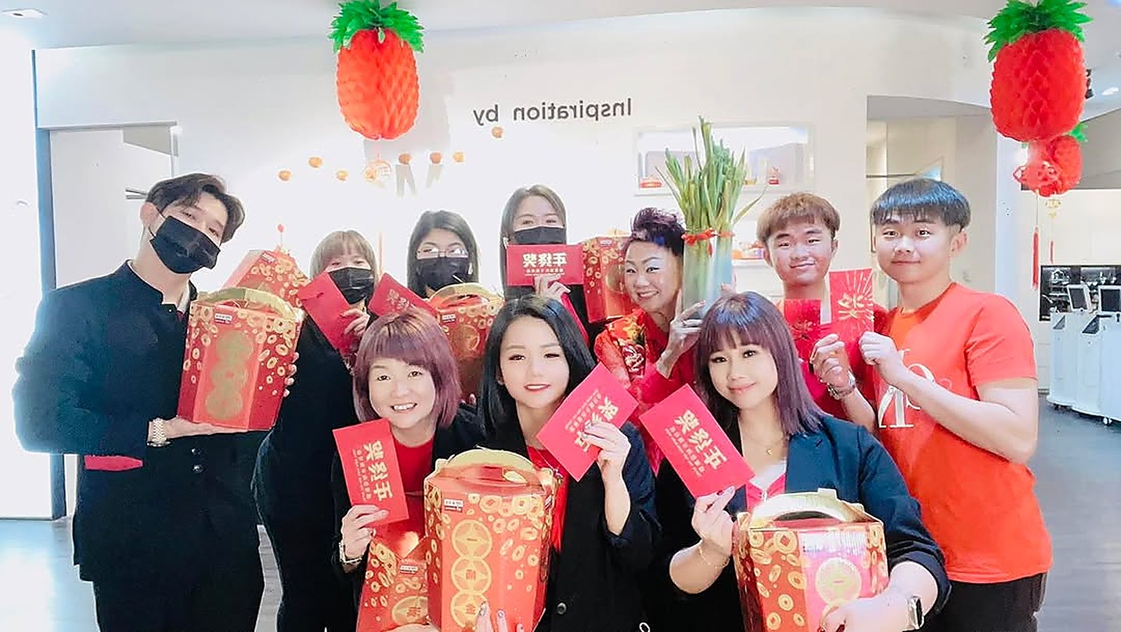 Inspiration Hair Approach team gathered for a Lunar New Year celebration inside the salon