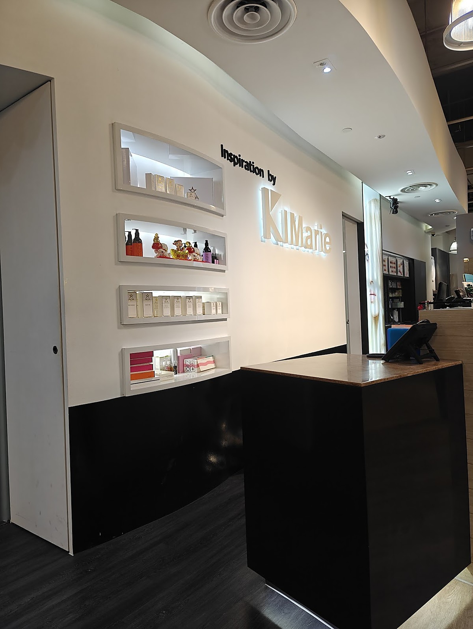 Inspiration Hair Approach salon reception with backlit display wall