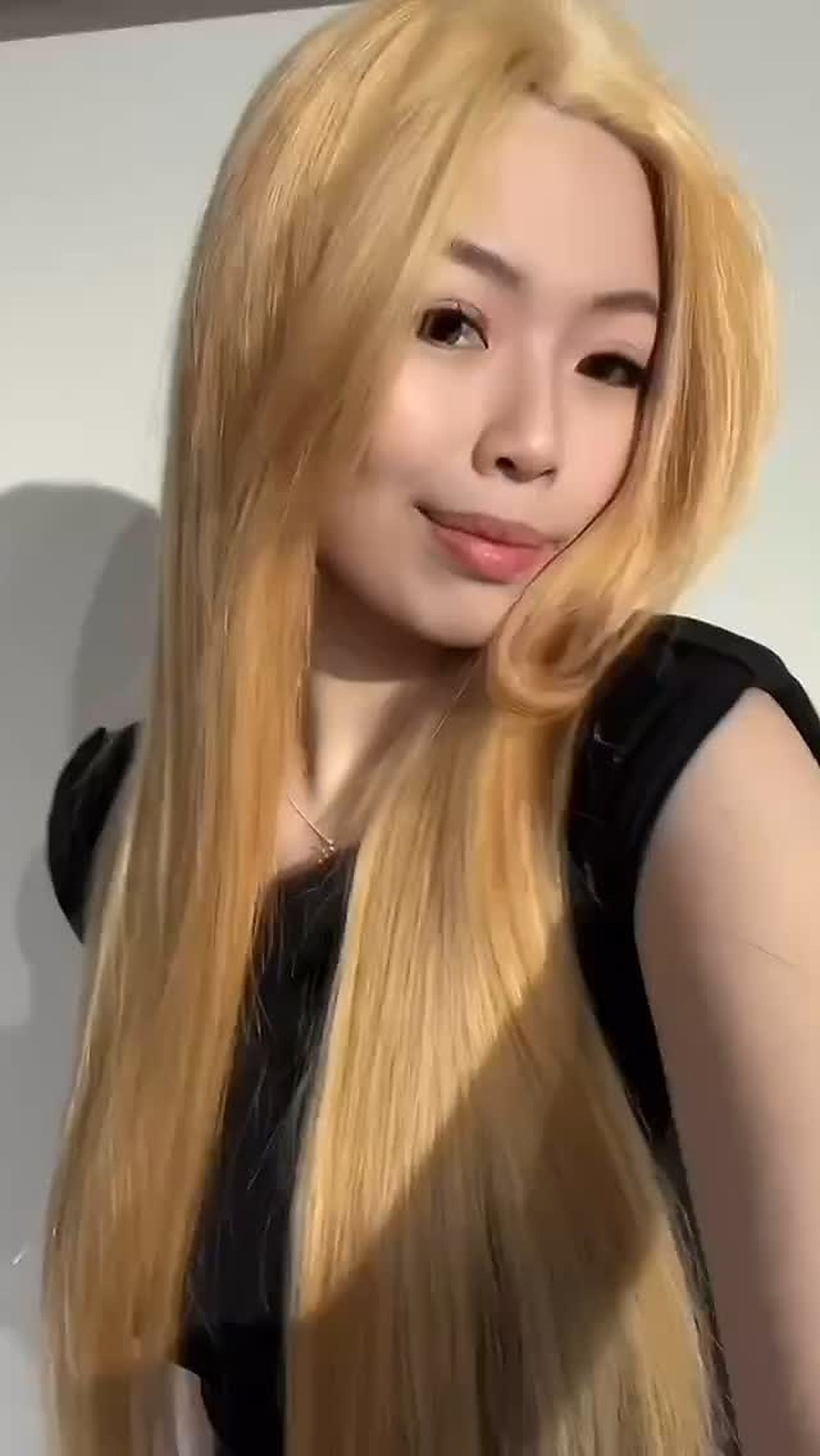 Long blonde hair result after extensions and styling