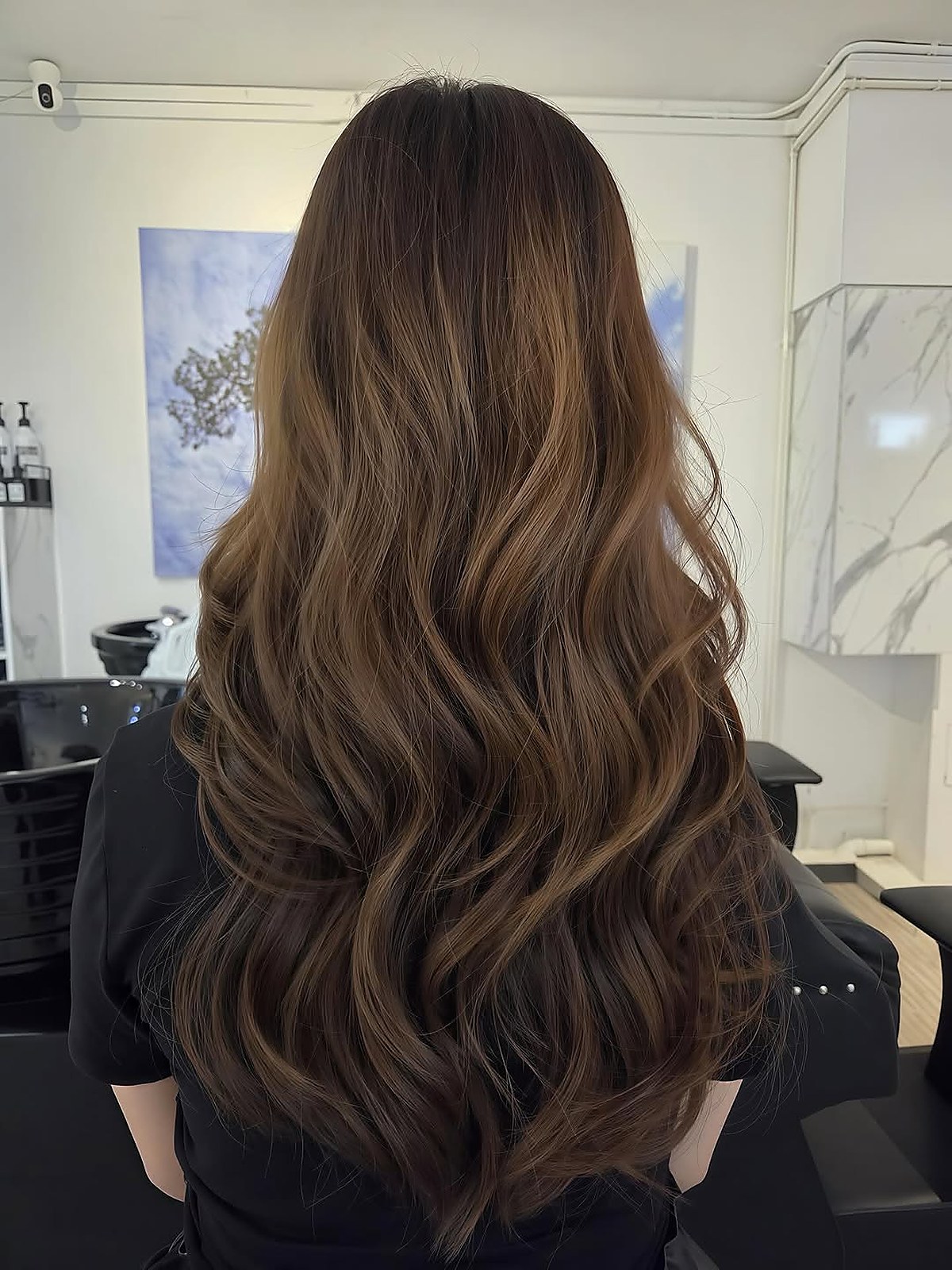 Long wavy hair colour result by Kimnison Studio