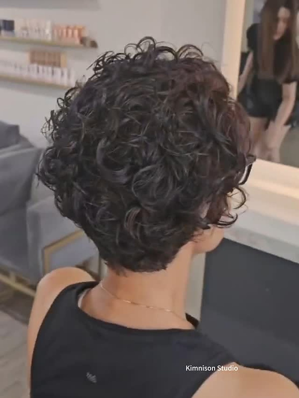 Curly perm finished look, back view