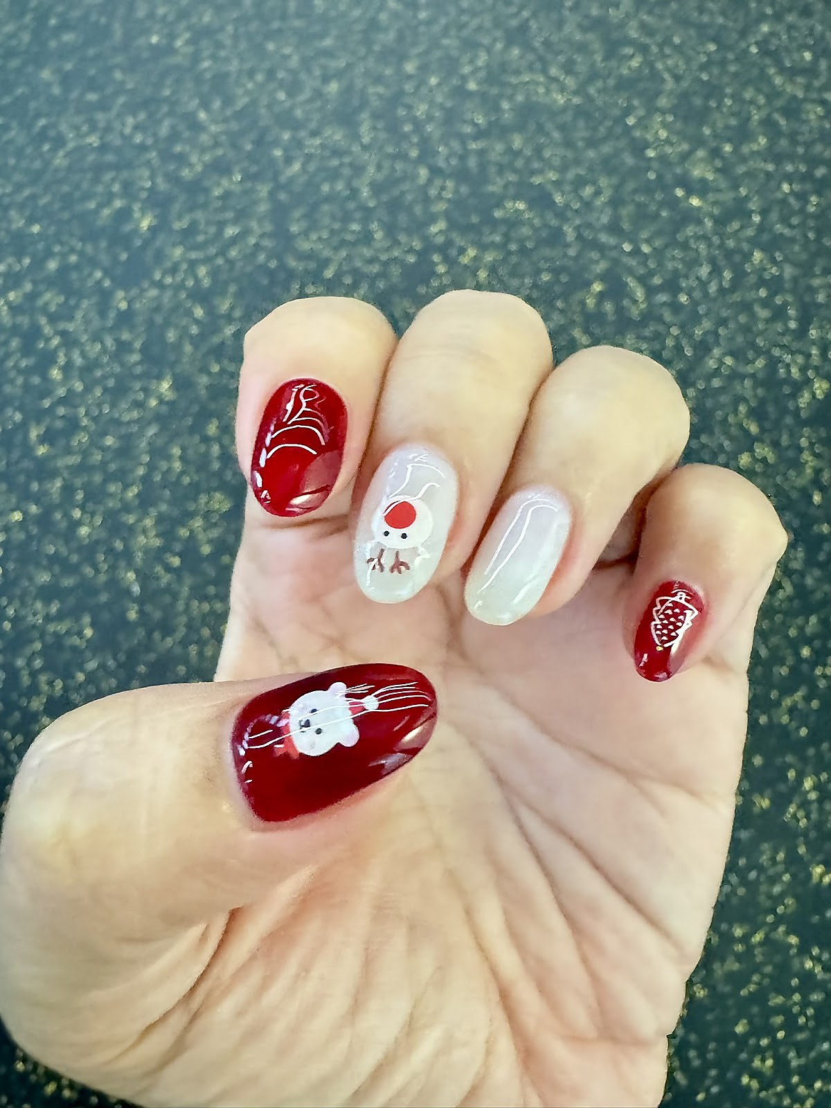 Festive nail art design with detailed motifs