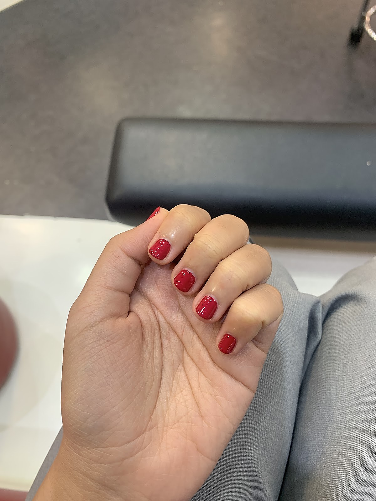 Red nail manicure result, glossy gel finish