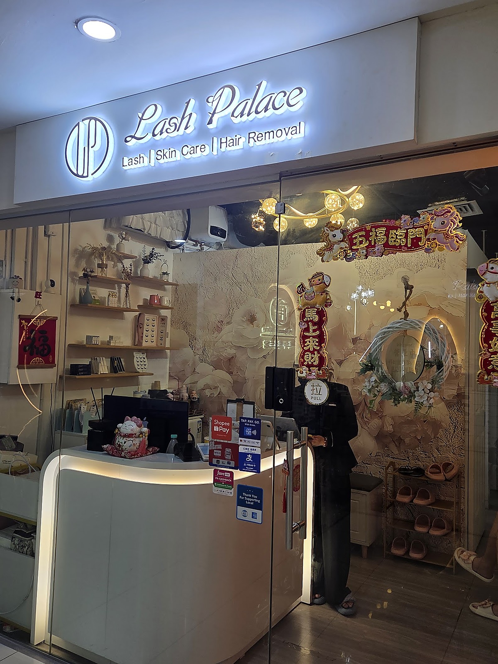 Lash Palace storefront and reception area with warm beige interior