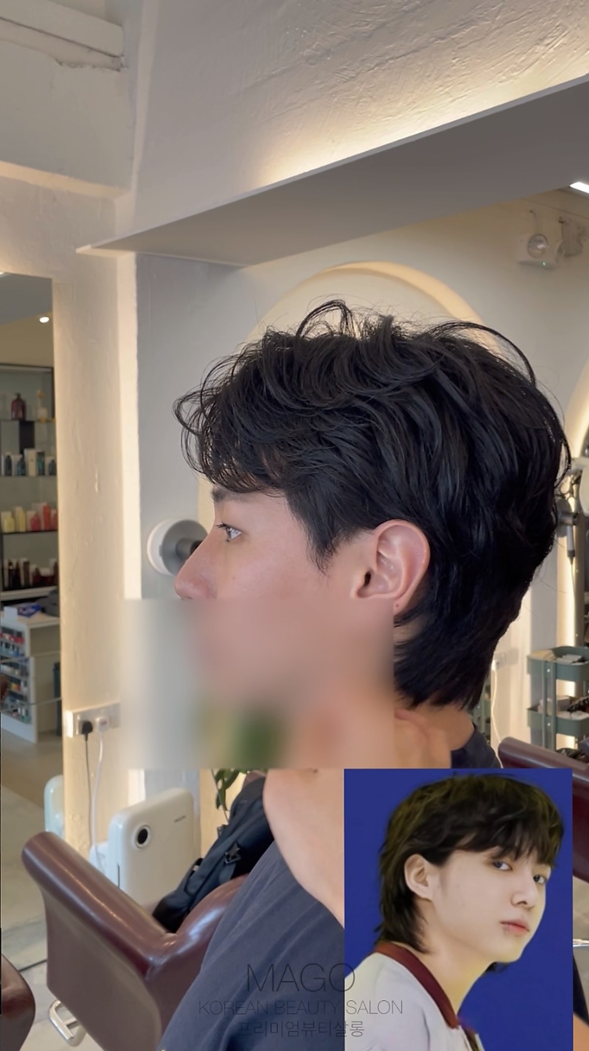 Short dark hair styled into a sleek finish