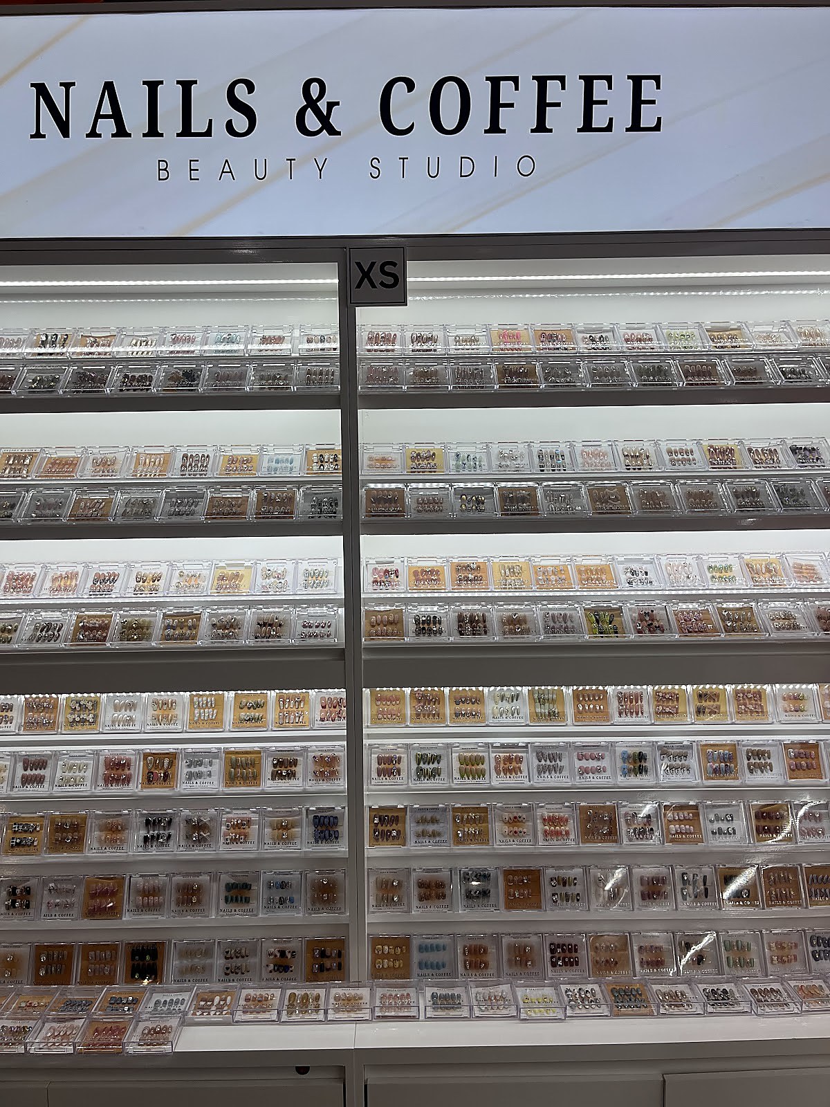 Nail polish display collection at Maison Glam