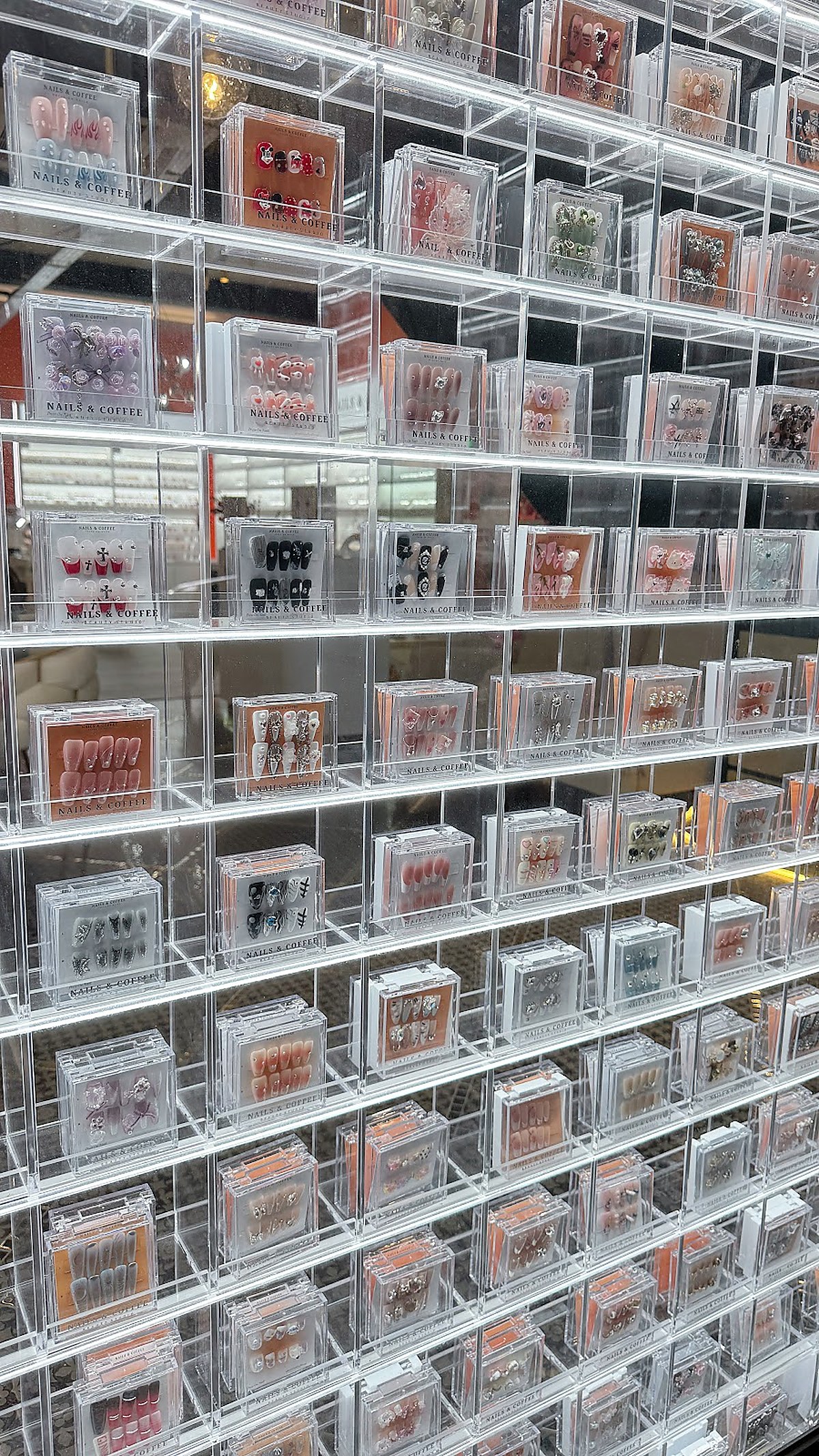 Nail art product display at Maison Glam
