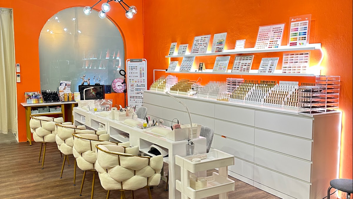 Modern beauty salon interior at Maison Glam with tangerine accents