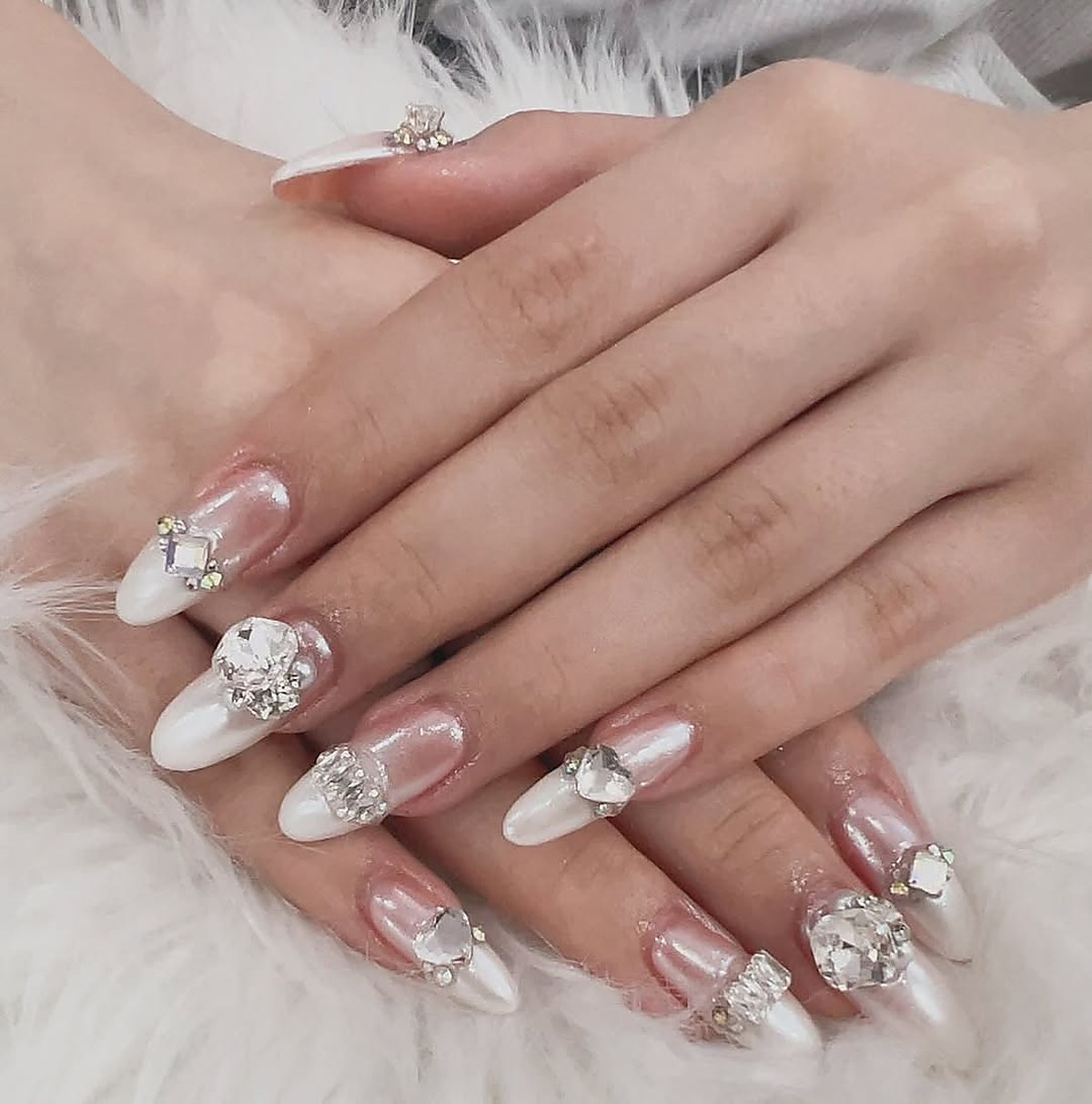 Bridal nail art with gems and pearl detailing