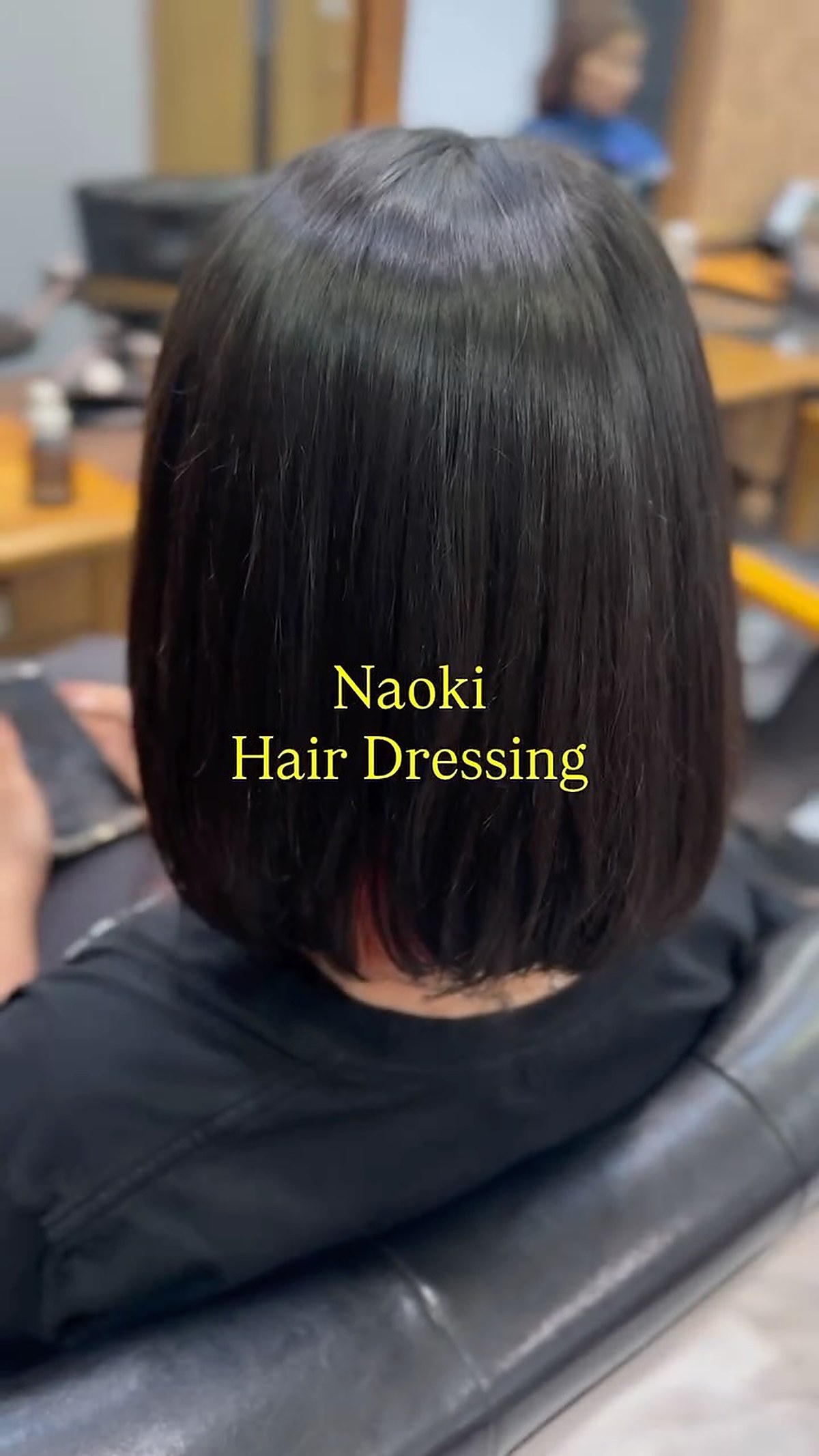 Sleek black bob haircut result