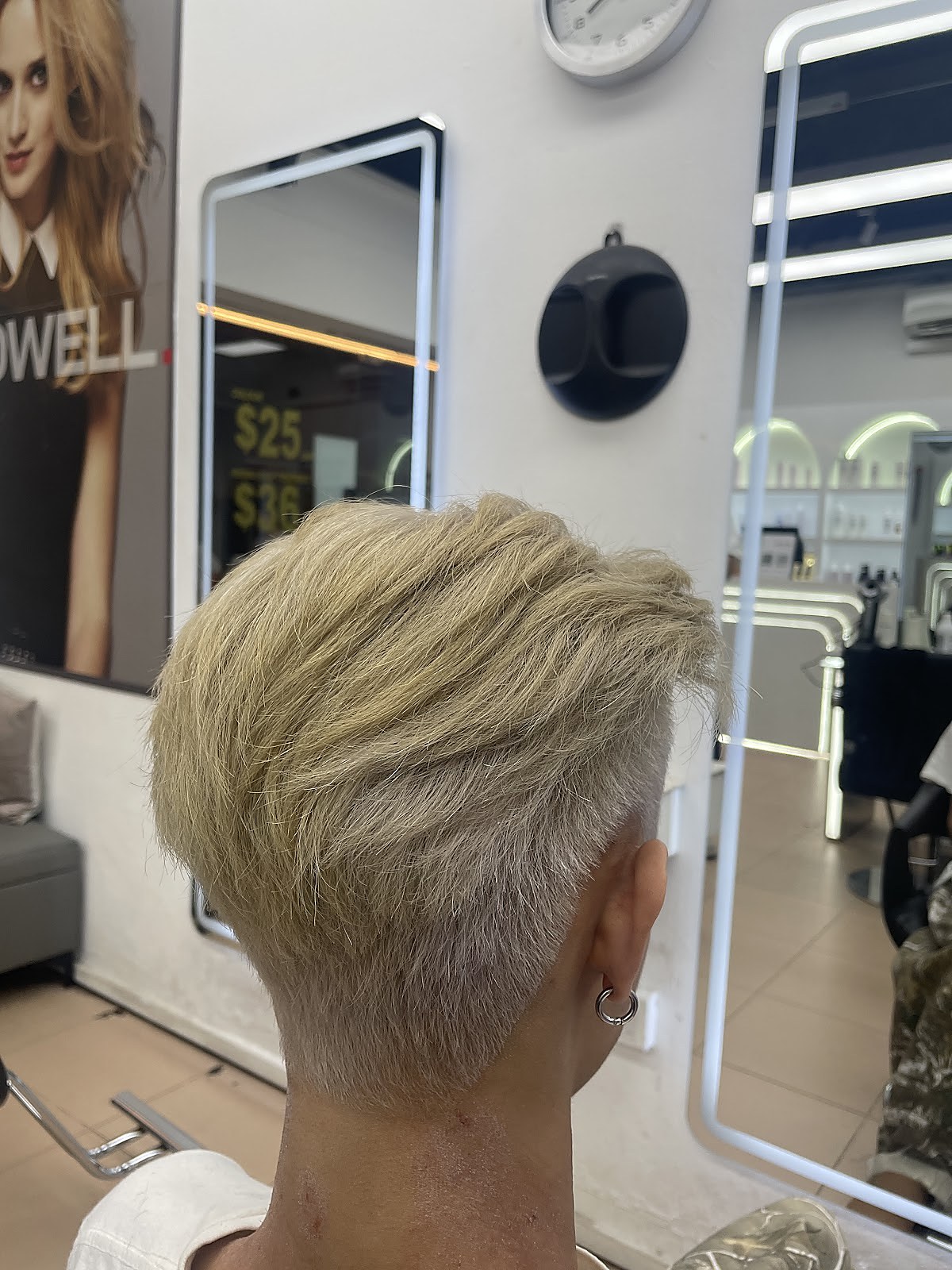 Short blonde pixie cut styled at Prominent Hair Studio