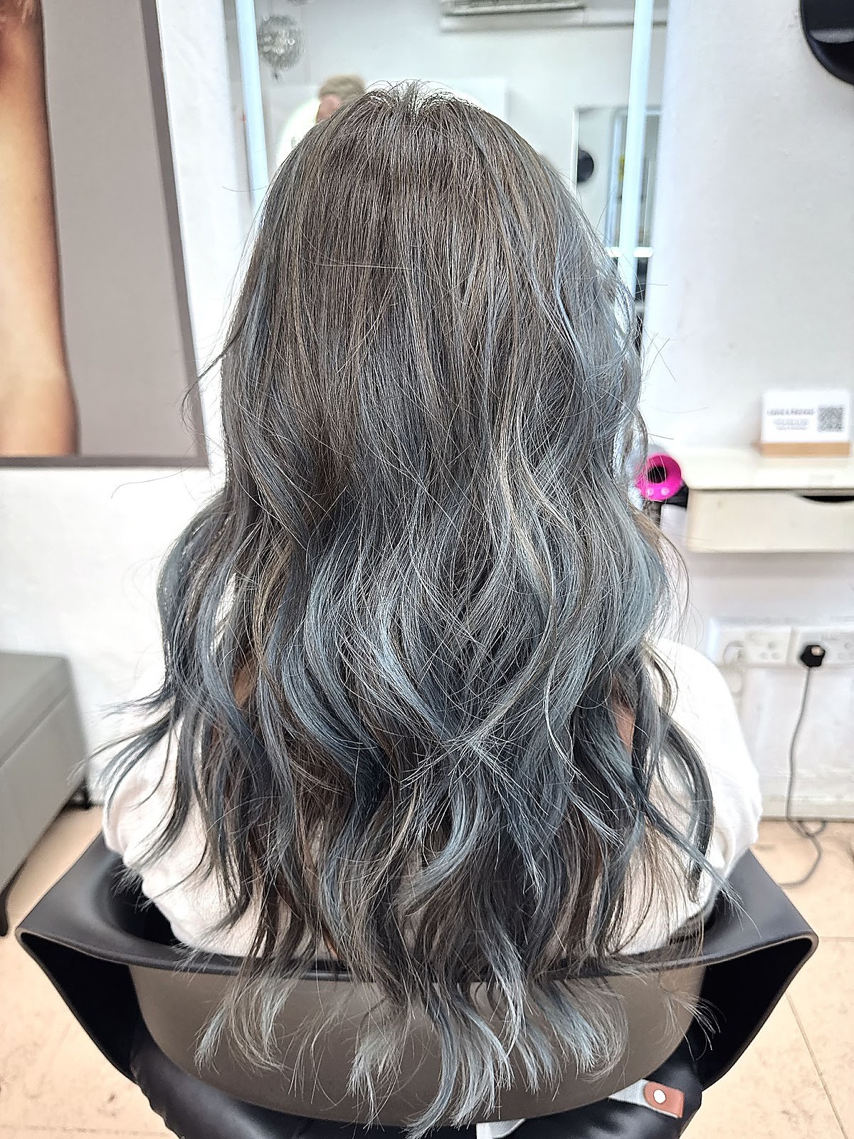 Long wavy hair styling done at Prominent Hair Studio