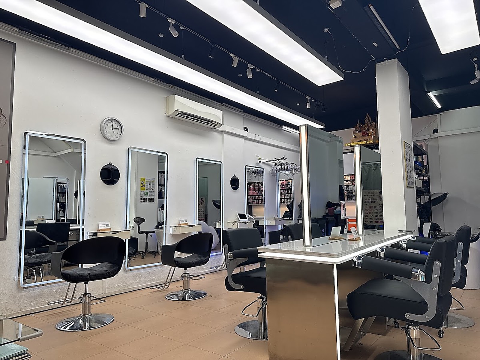 Modern salon interior with mirrors at Prominent Hair Studio