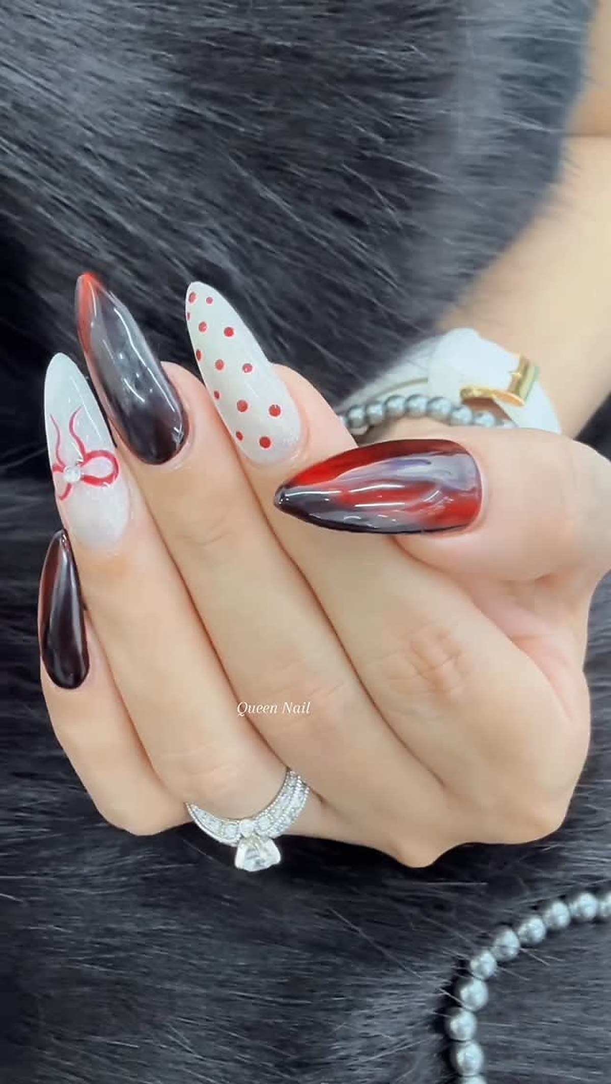 Nail art design showcase with detailed embellishments