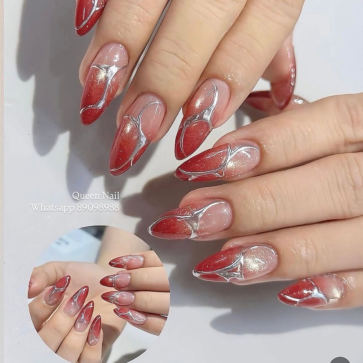 Red glitter nail art design with jewel embellishments