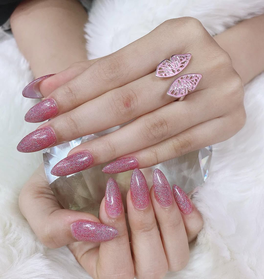 Glitter nail art and finished manicure in the studio