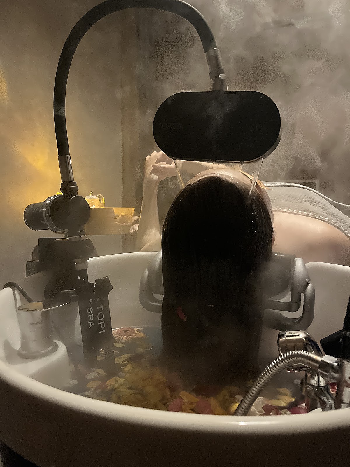 Hair spa treatment with steam in a calm seated room