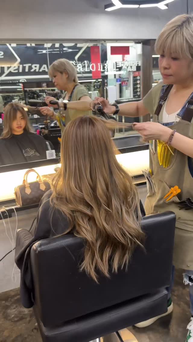 Hair styling salon service in progress