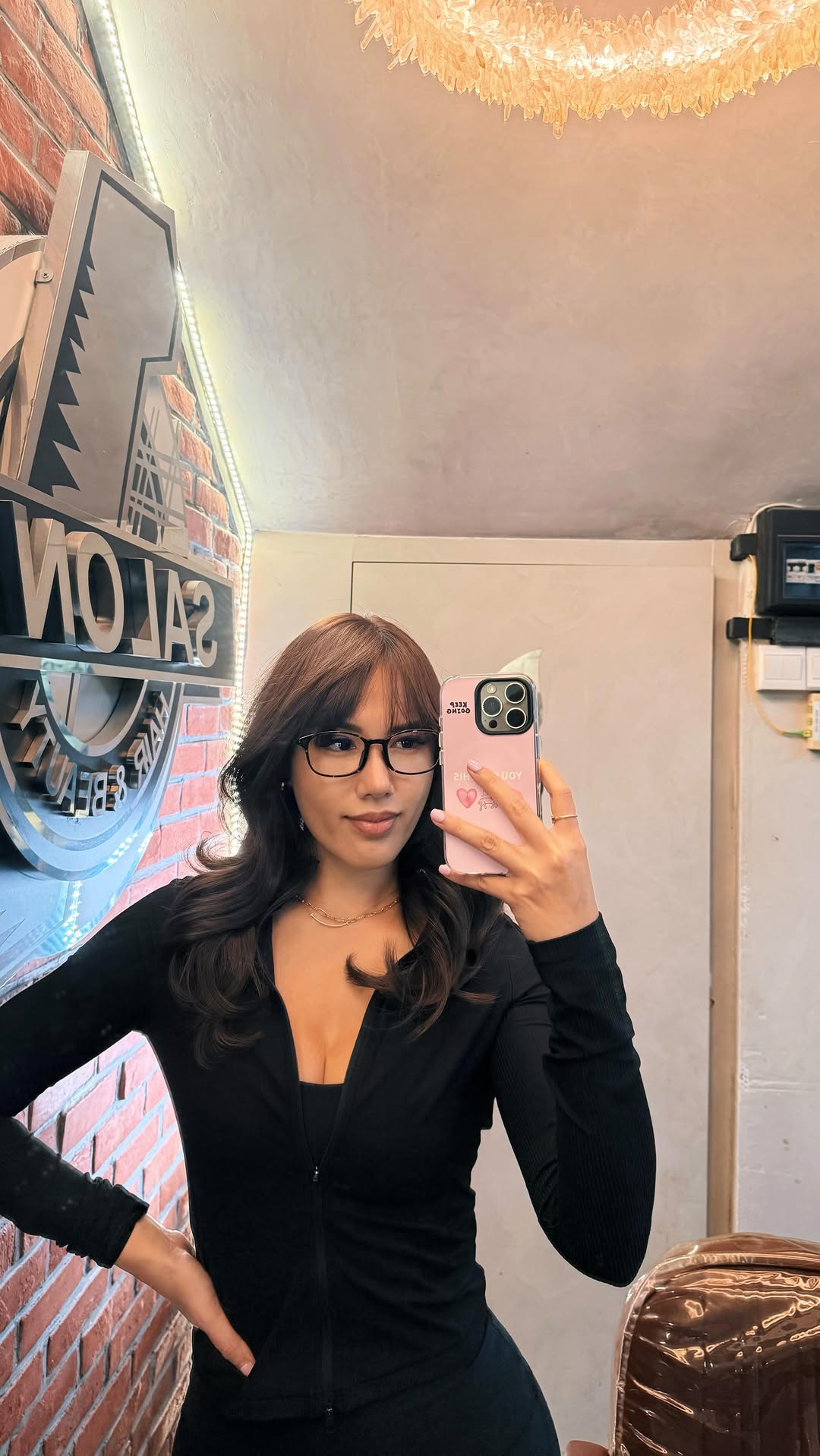 Salon selfie portrait of client with glasses