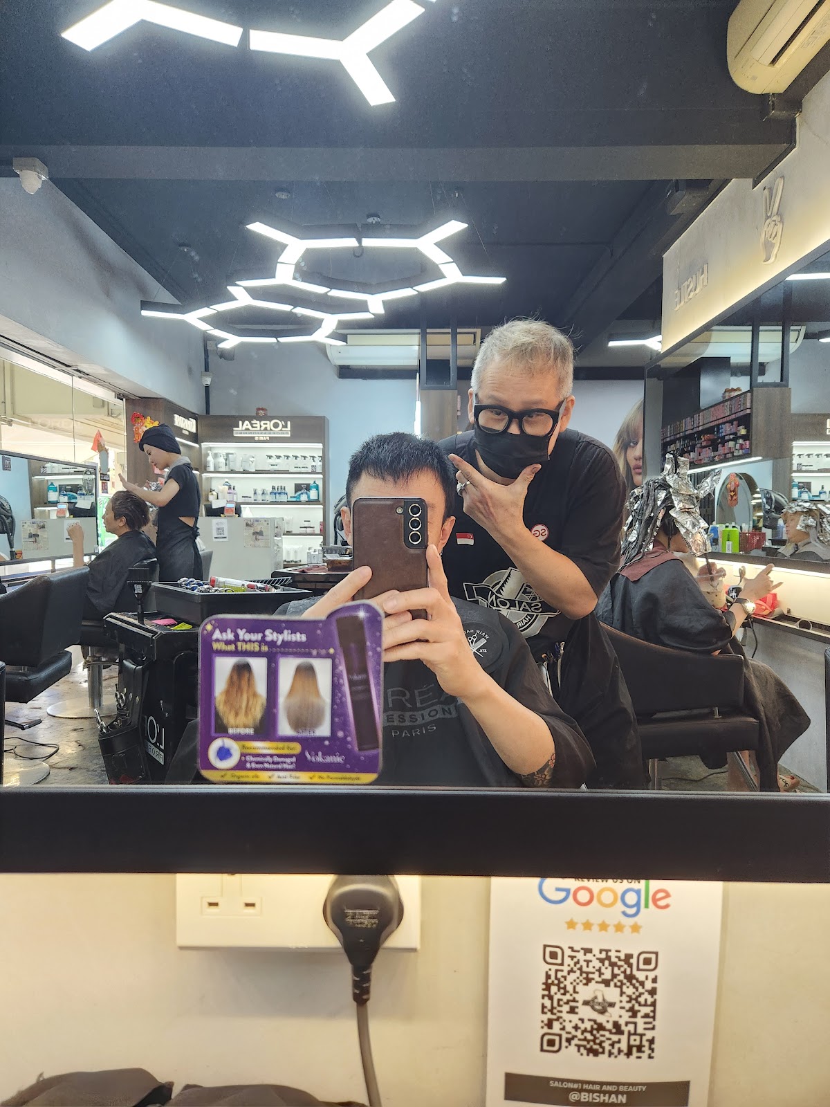 Salon staff arranging the product display