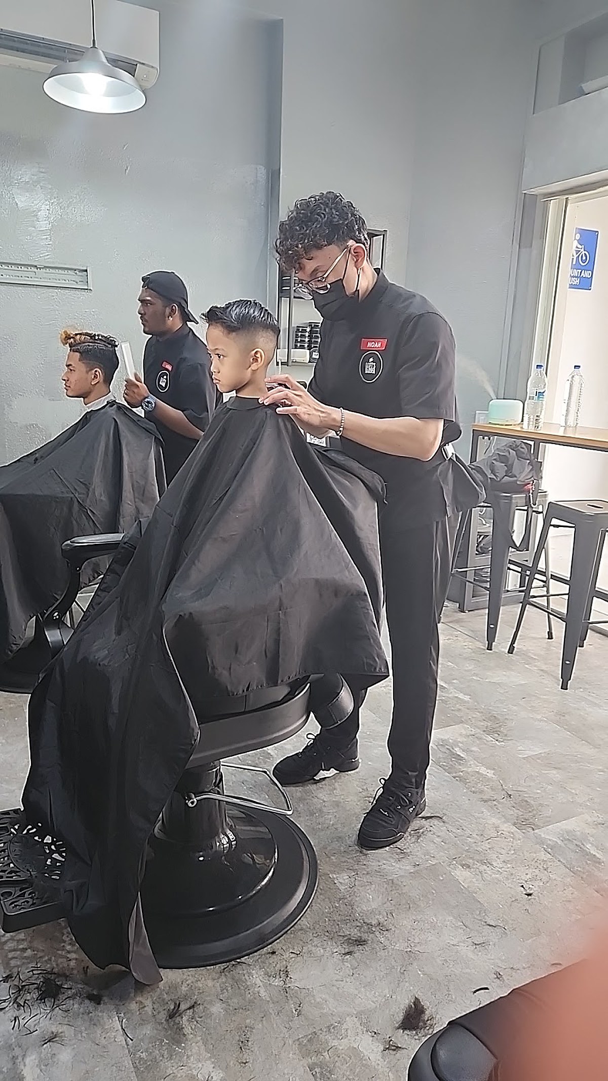 Barber haircut styling in process — work in the chair