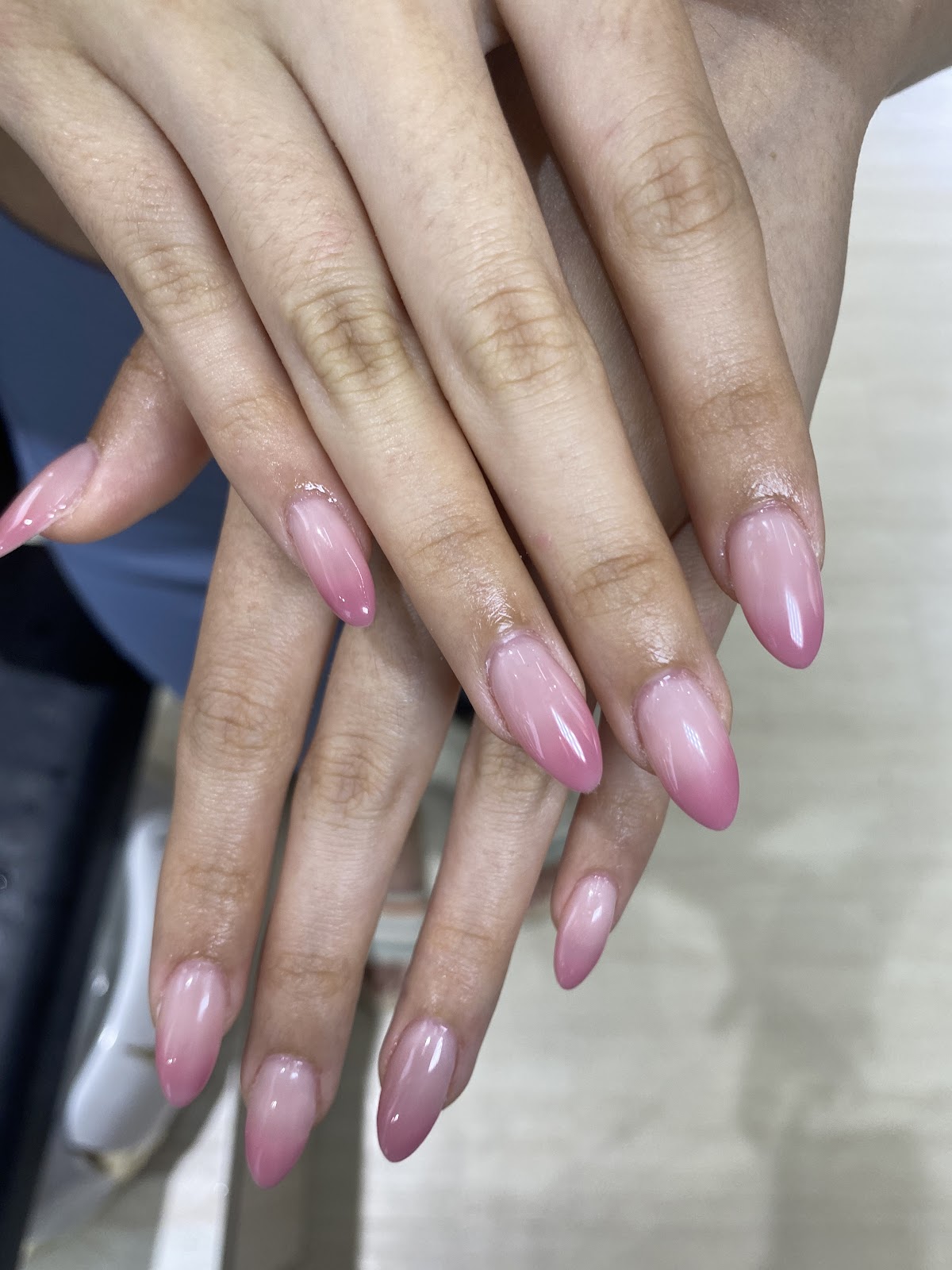 Glossy pink almond gel manicure by The nail journal