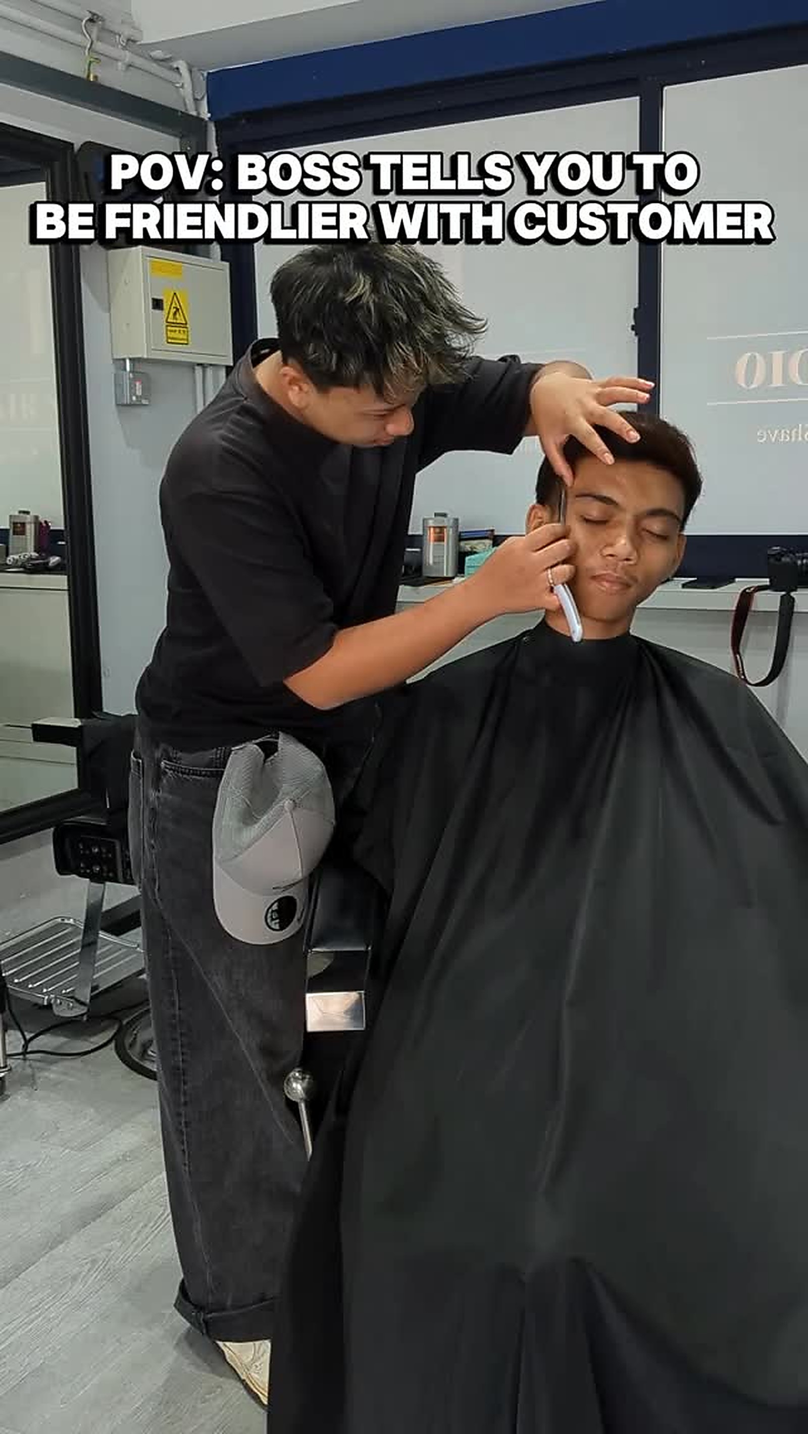 Barber haircut service in progress at TL Hair Studio SG