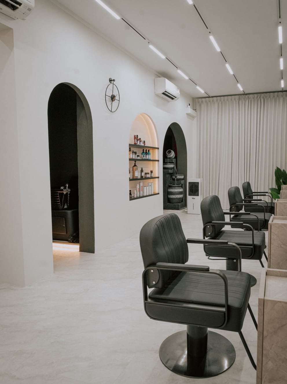 Modern salon interior with styling chairs at Wecut Hair Salon